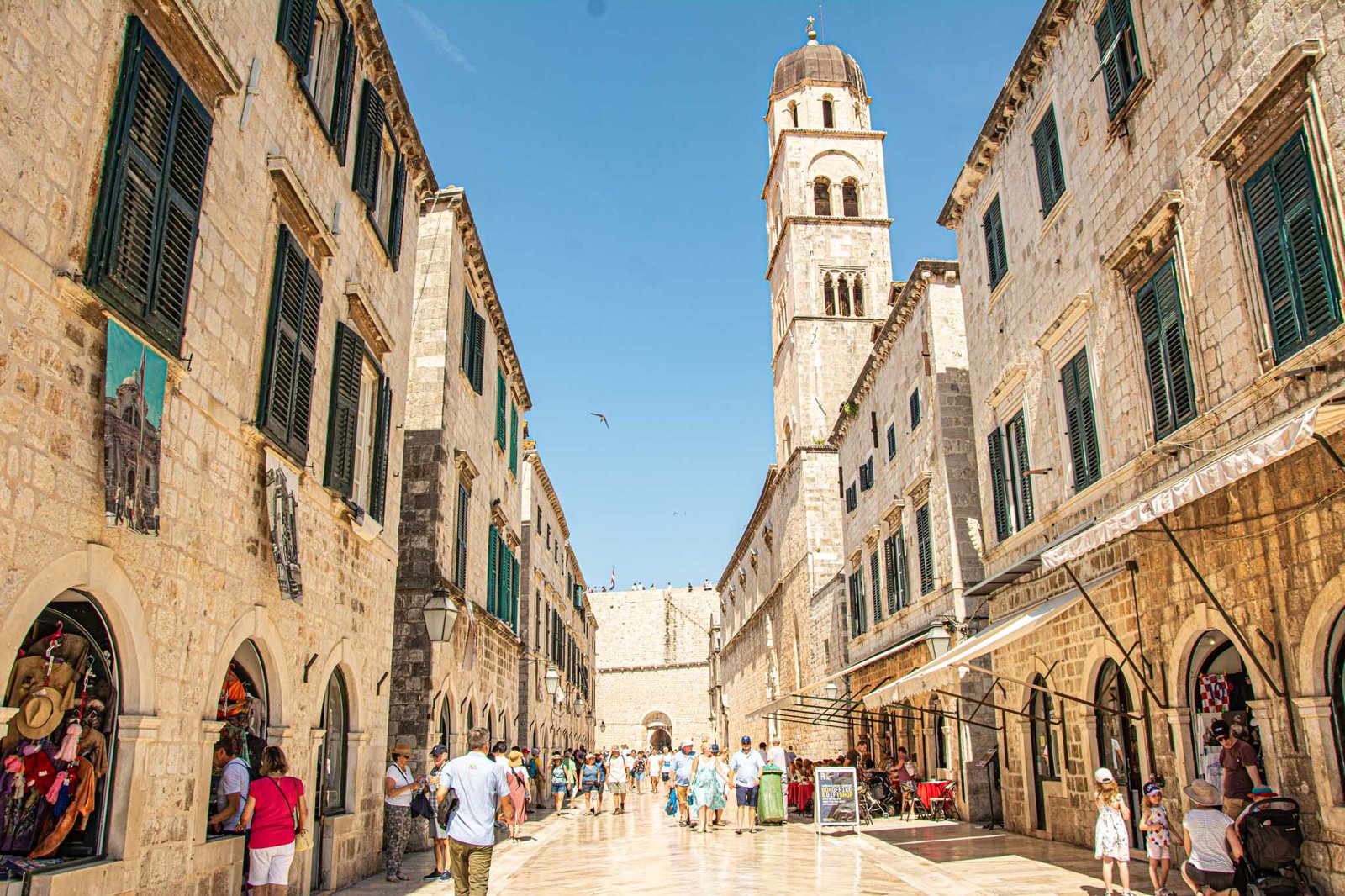 A stone street and bell tower in historic Croatia