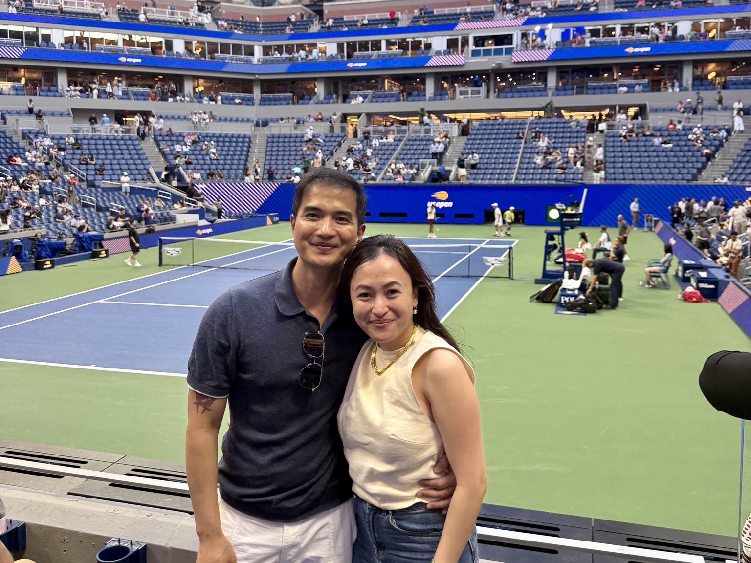 Frances and Francis beside the tennis court at the US Open in New York