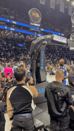 Francis filming LeBron James courtside
