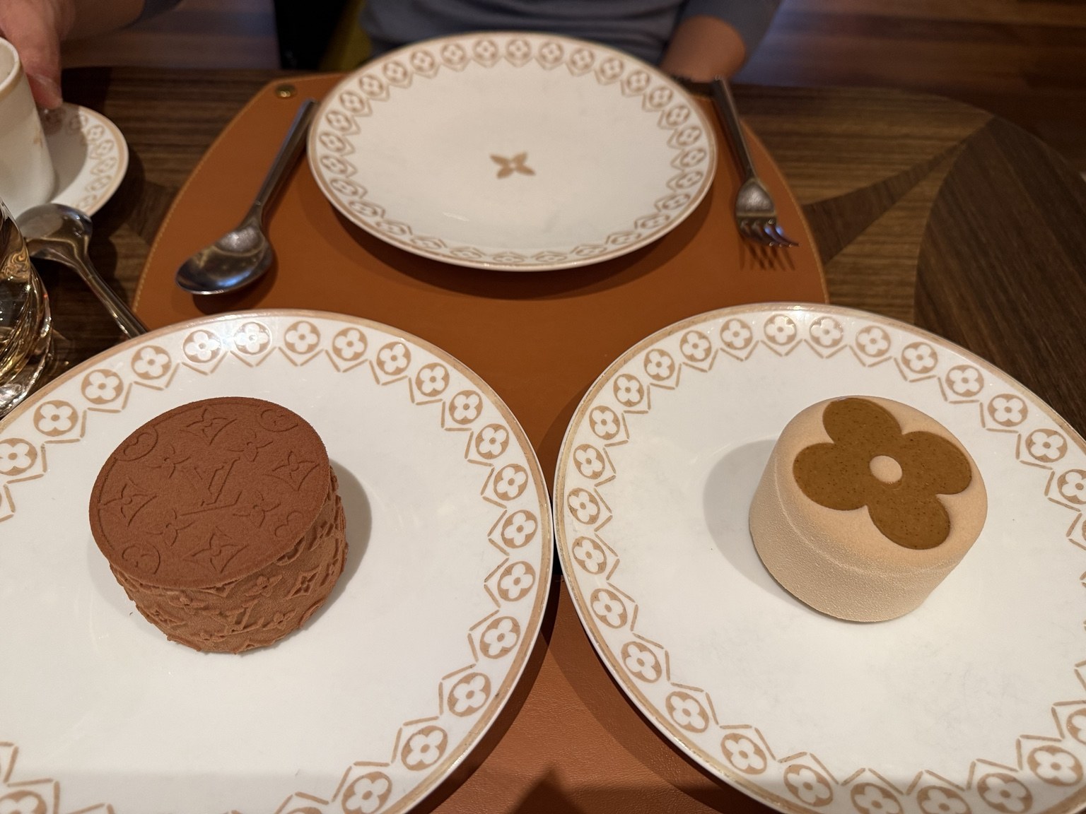 Chocolate Monogram and Hazelnut Flower, $26 each.