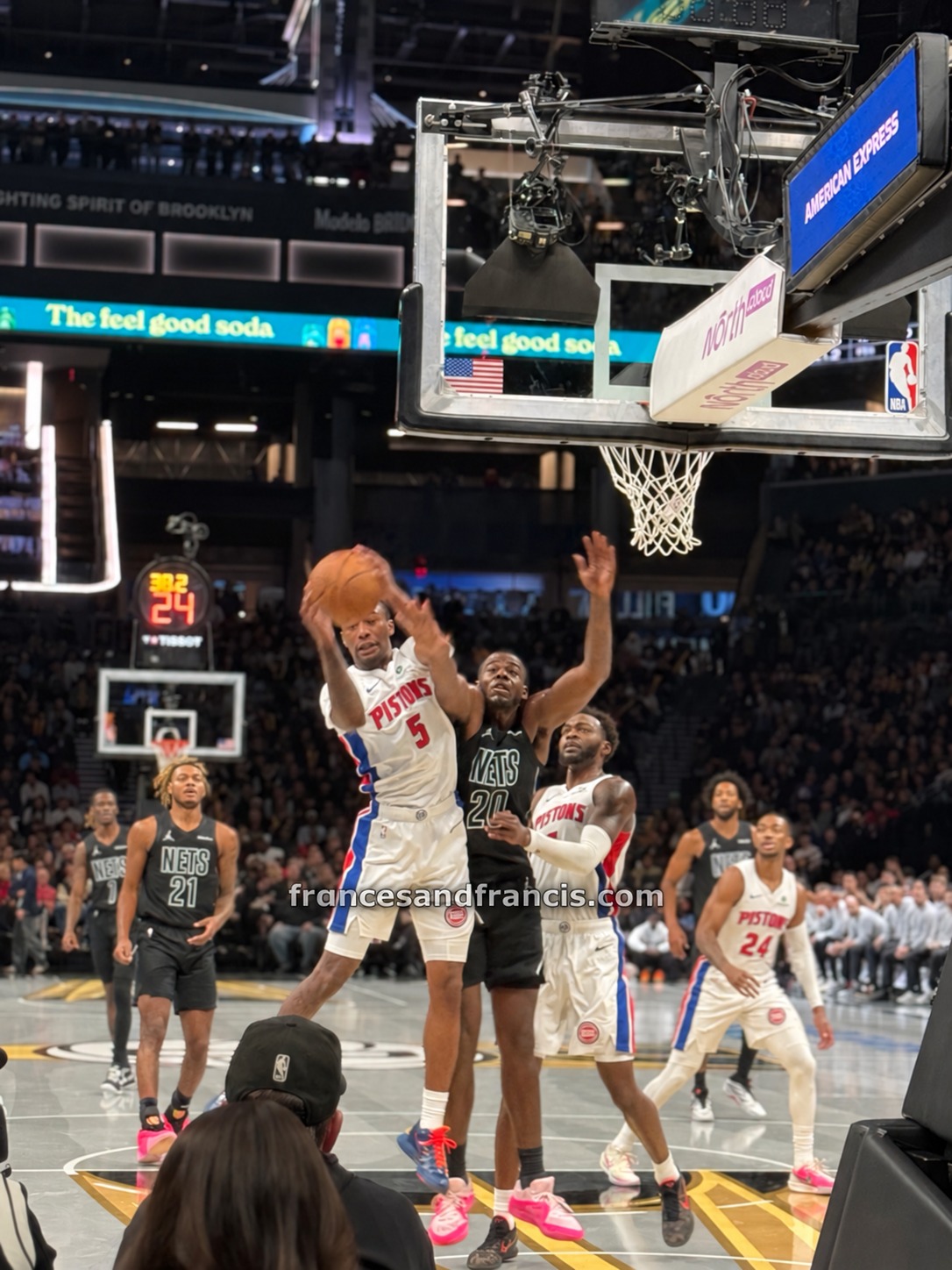 A battle for the ball near the basket.